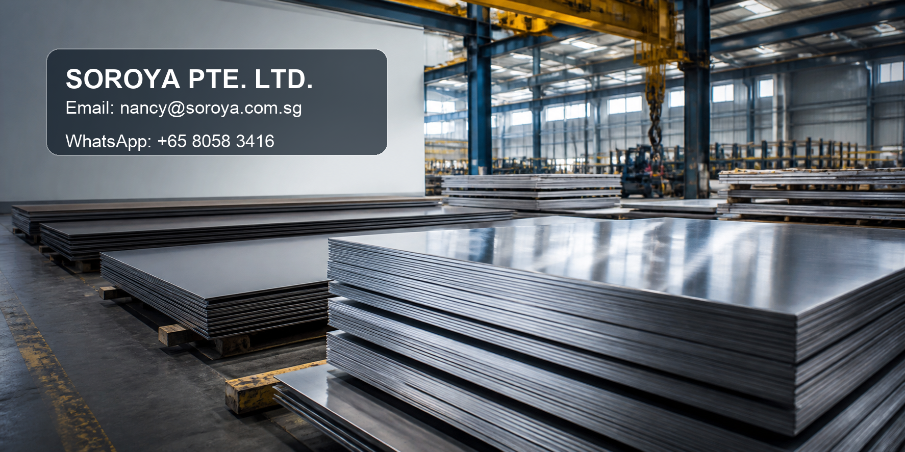Stacks of stainless steel plate in an industrial warehouse with SOROYA PTE. LTD. contact details