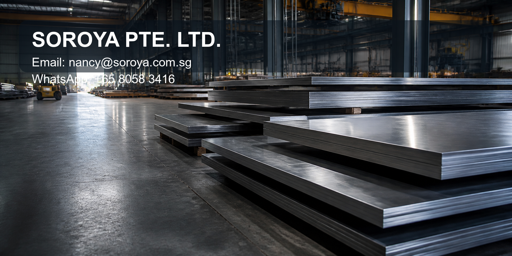 Stacks of stainless steel plate in an industrial warehouse with SOROYA PTE. LTD. contact details
